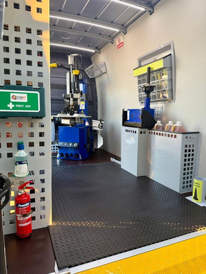 Inside the Knightcott van: a tyre changer and balancer, a first aid kit and a fire extinguisher